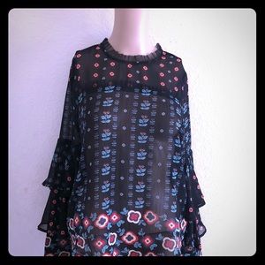 A Black sheer multi color blouse.